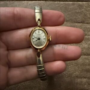 Timex Women's Gold and Silver Two-Tone Oval Bracelet Watch